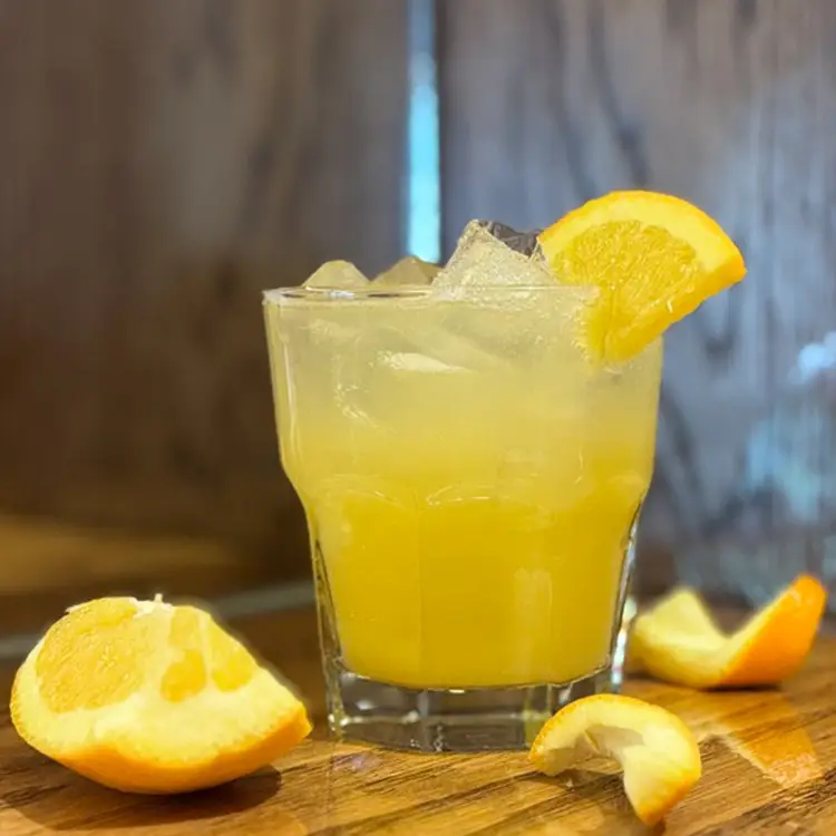 Citrus designer mocktail with orange wedges at Morton's Tavern