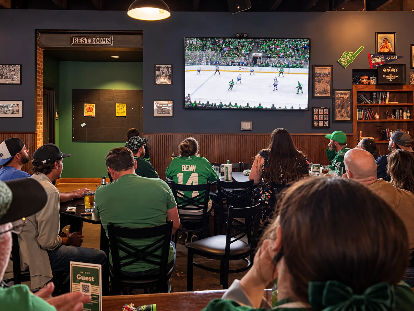 Fans watching hockey on the big TV at the Morton's Tavern sports bar in Fort Worth