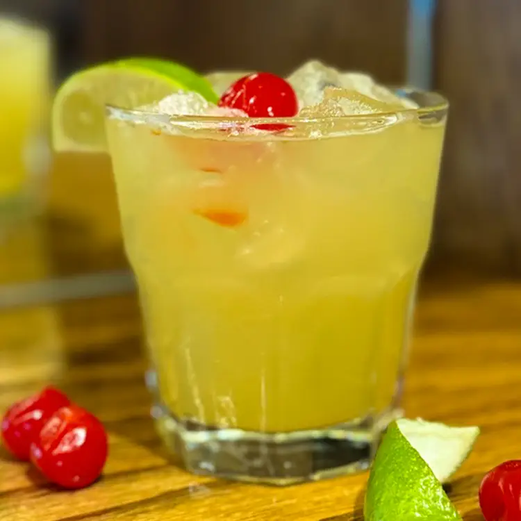 Zero-proof lime mocktail with a cherry at Morton's Tavern